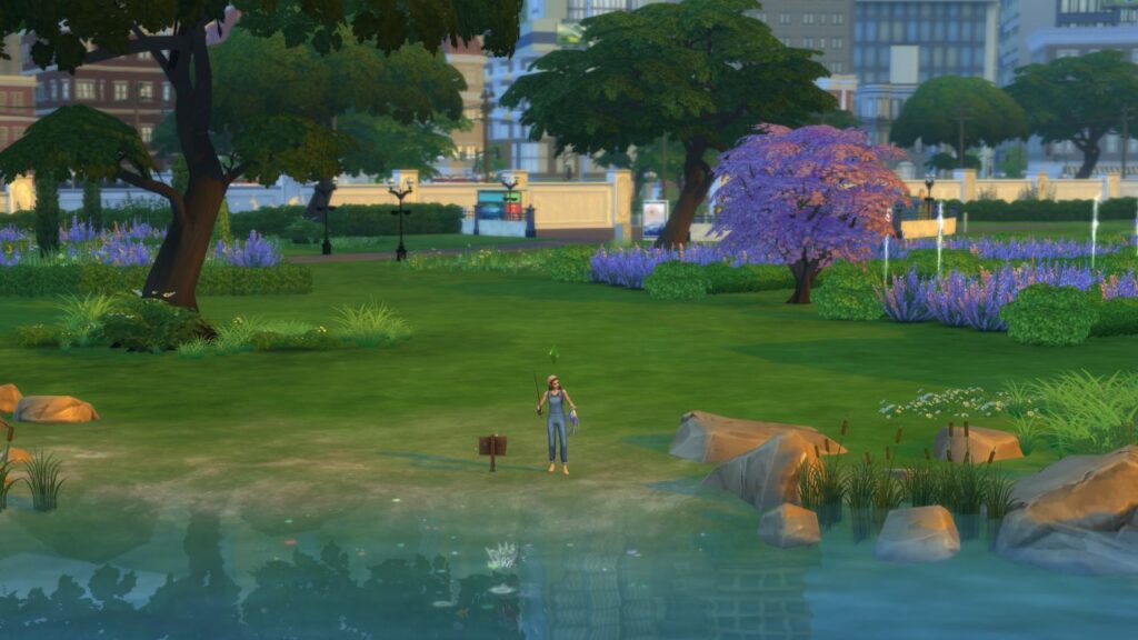 A screenshot from The Sims 4 showing the location of a fishing spot on the left side of Myshuno Meadows Park