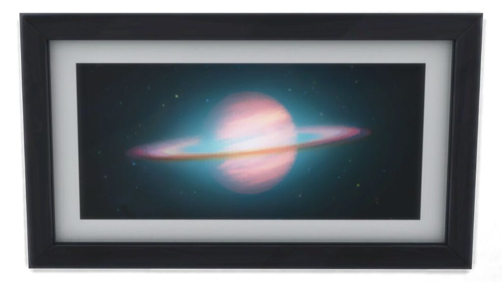 A screenshot from The Sims 4 showing a black frame with a print of an image of saturn blurred in pinks and blues