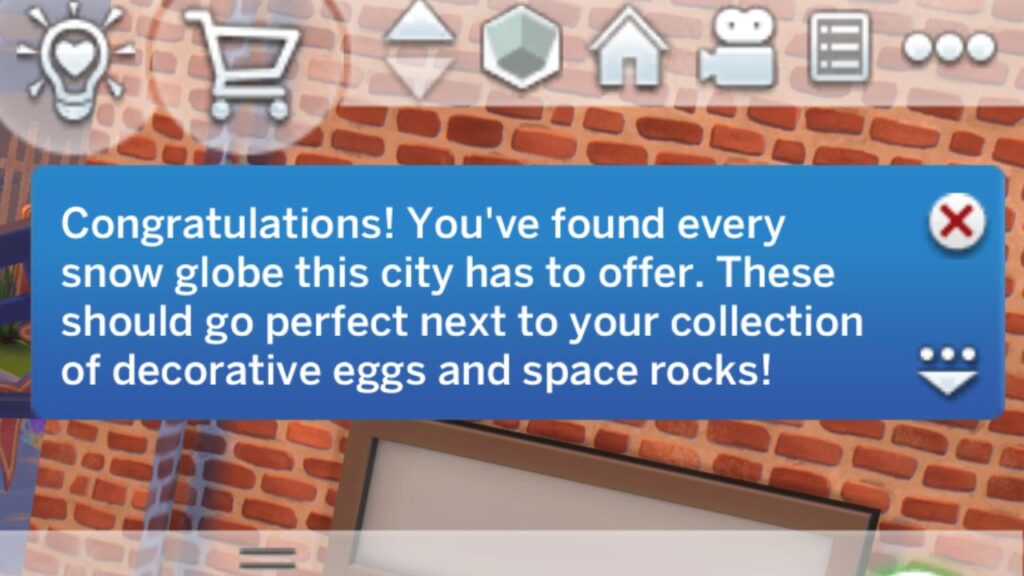 A screenshot from The Sims 4 showing the notification you get after finishing the snow globes collection