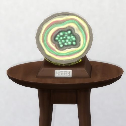 A screenshot from The Sims 4 with a brown table and on top is the geode named Star Flake