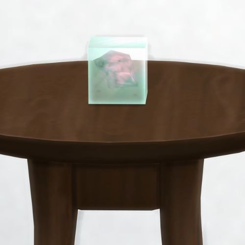 A screenshot from The Sims 4 showing a dark brown table with a Volenton element in a square on top