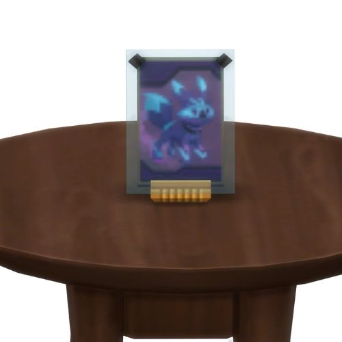 A screenshot from The Sims 4 showing a brown table with a Voidcritter on top. This has the voidcritter named vulpes