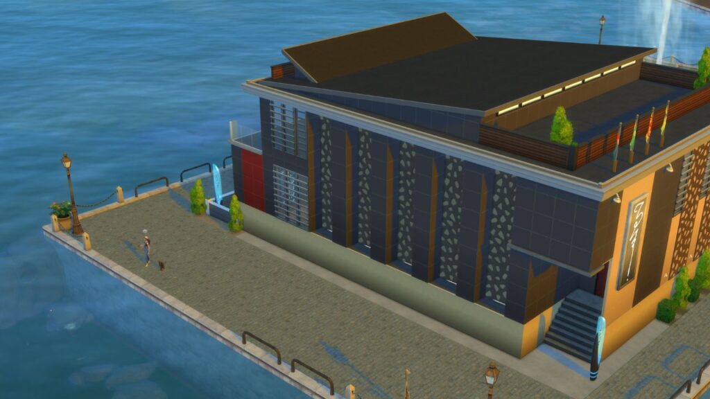 A screenshot from The Sims 4 showing a fishing spot in Windenburg to the left of the nightclub