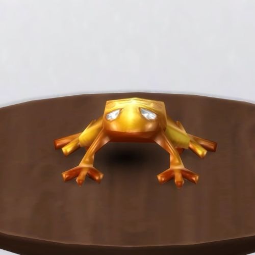 A screenshot from The Sims 4 showing a brown circle table and on top is a golden frog with white eyes