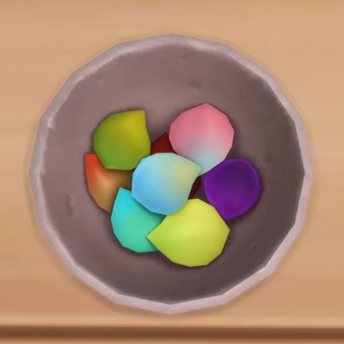 A screenshot from The Sims 4 showing a bowl on a wooden floor. Inside the bowl is a bunch of colourful flower petals 