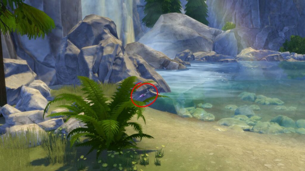 A screenshot from The Sims 4 showing where to find a dragon dragonfly next to a water fall