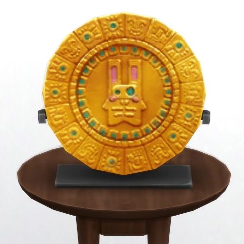 A screenshot from The Sims 4 showing a brown circle table and on top is golden plate with emerald designs