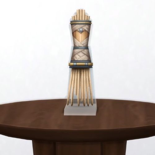 A screenshot from The Sims 4 showing a brown table with The Fingers of Sulani in beige 