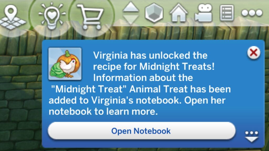 A screenshot from The Sims 4 showing a notification showing a sim has learned an animal treat recipe